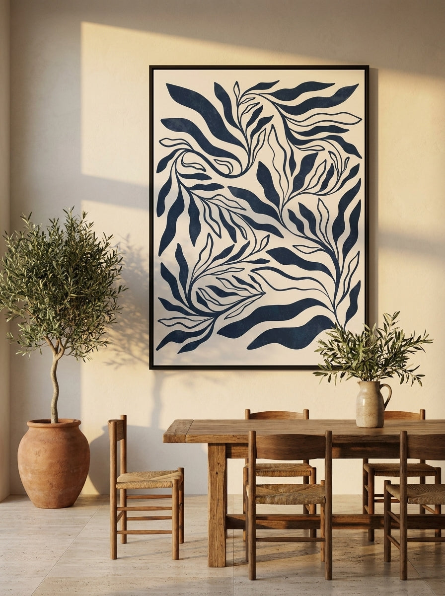 Oversized statement canvas wall art with a black surround styled on the wall in a Mediterranean dining room
