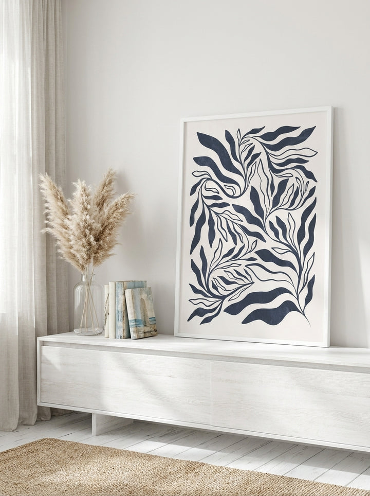 Modern wall art print standing on a console in a coastal home office