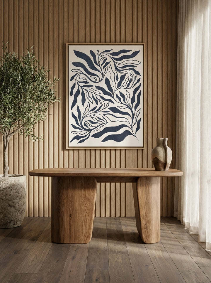 Canvas wall art with a natural timber surround styled on the wall in a luxe home office