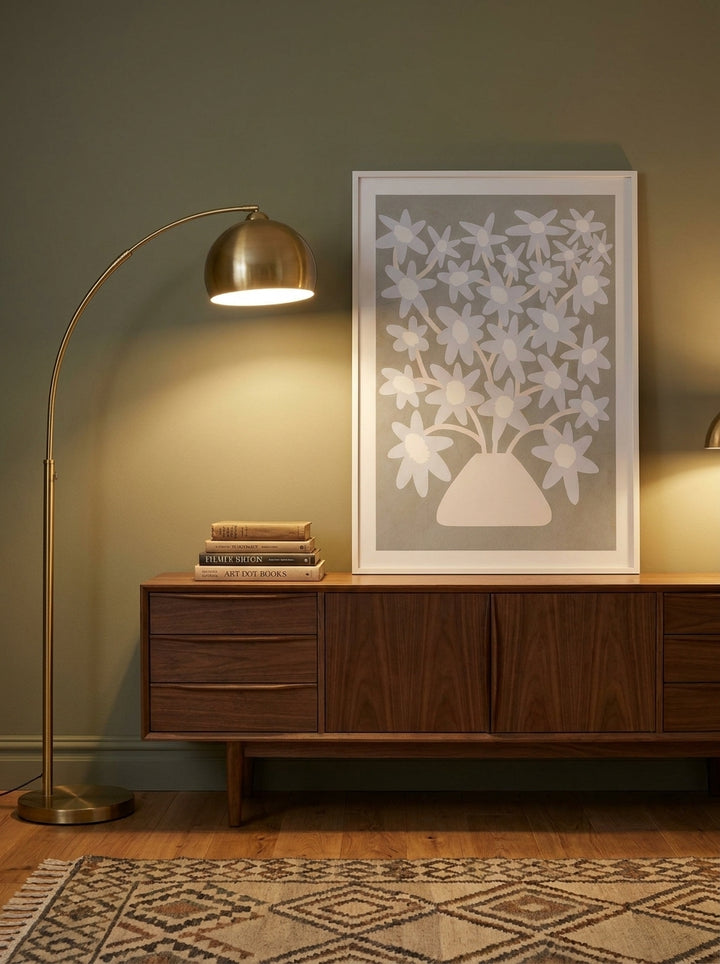 Modern wall art print standing on a sideboard in a mid-century home office