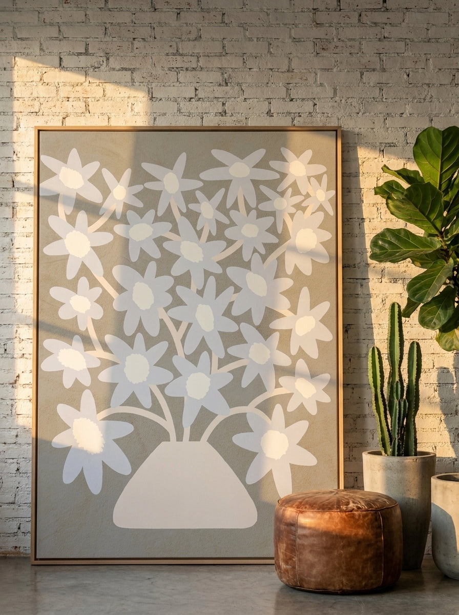 Oversized statement canvas wall art with a natural timber surround leaning against the wall in an industrial loft living room
