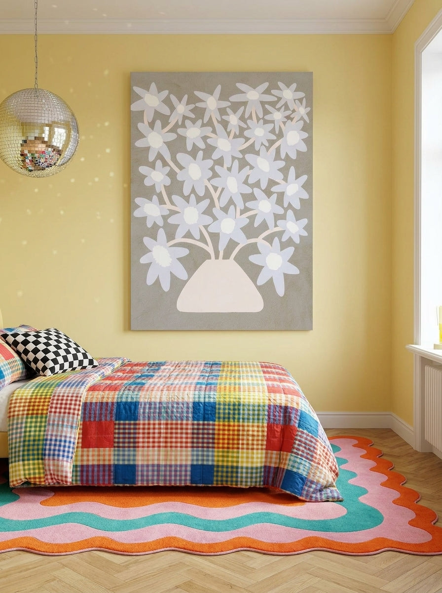 Stretched canvas wall art styled on the wall in a colourful eclectic bedroom