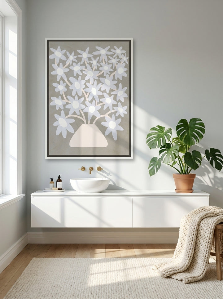 Oversized statement canvas wall art with a white surround styled on the wall in a bright Scandinavian bathroom