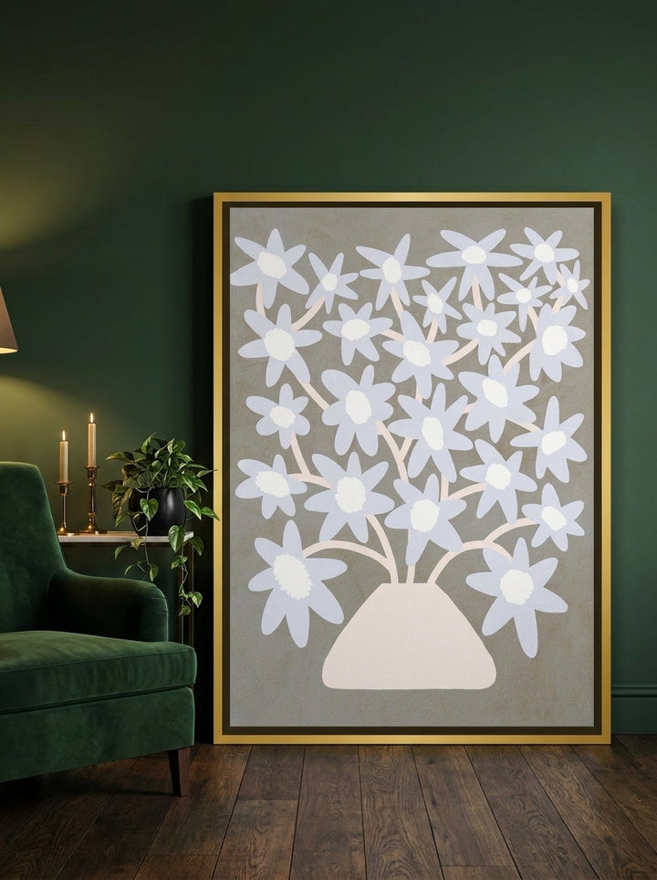 Canvas wall art with a gold leaf surround leaning against the wall in a moody kitchen
