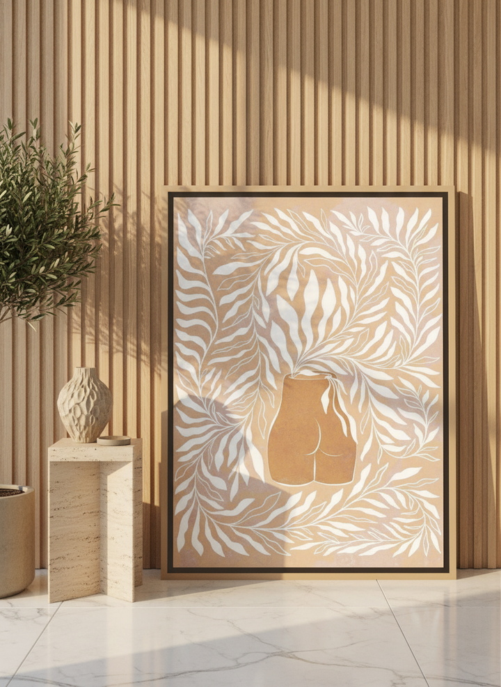 Canvas wall art with a natural timber surround leaning against the wall in a luxe bathroom