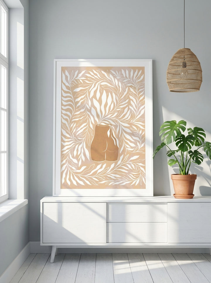 Modern wall art print standing on a sideboard in a bright Scandinavian bathroom