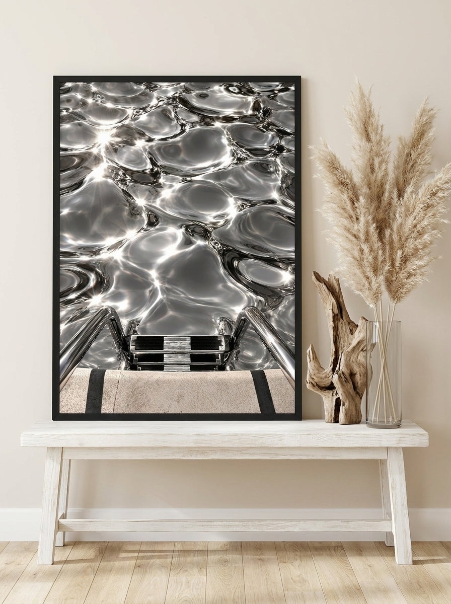 Modern wall art print standing on a console in a coastal bathroom