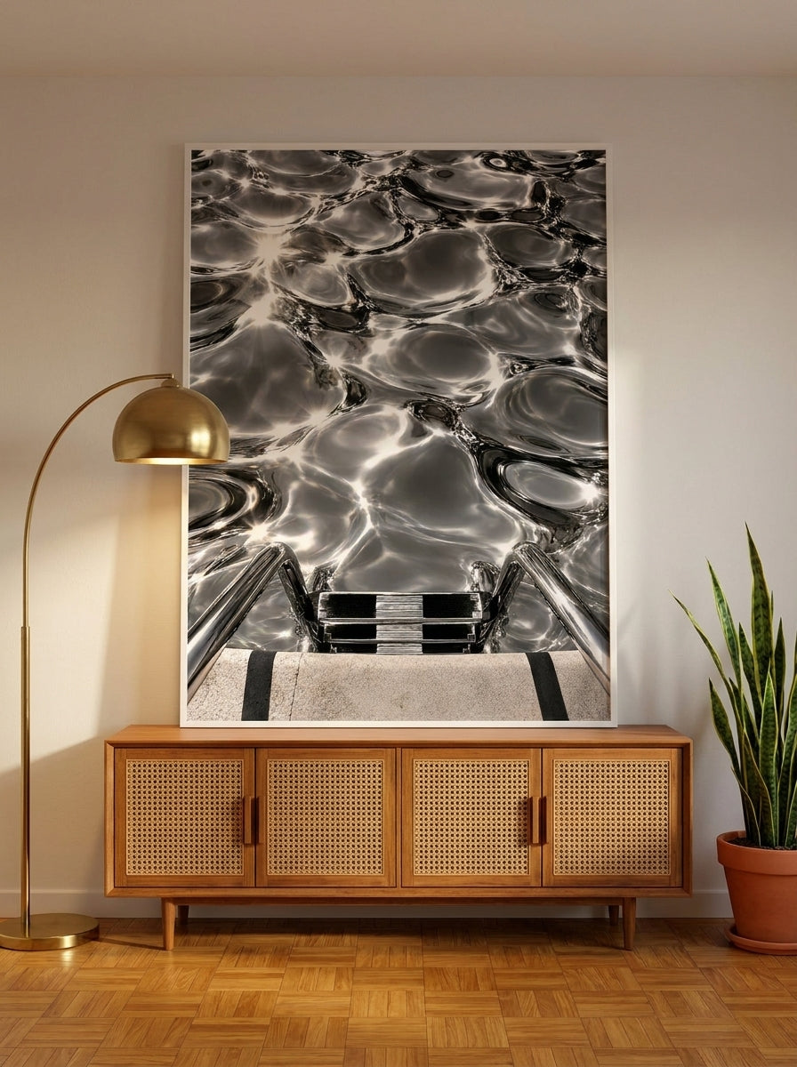 Modern wall art print standing on a sideboard in a mid-century home office