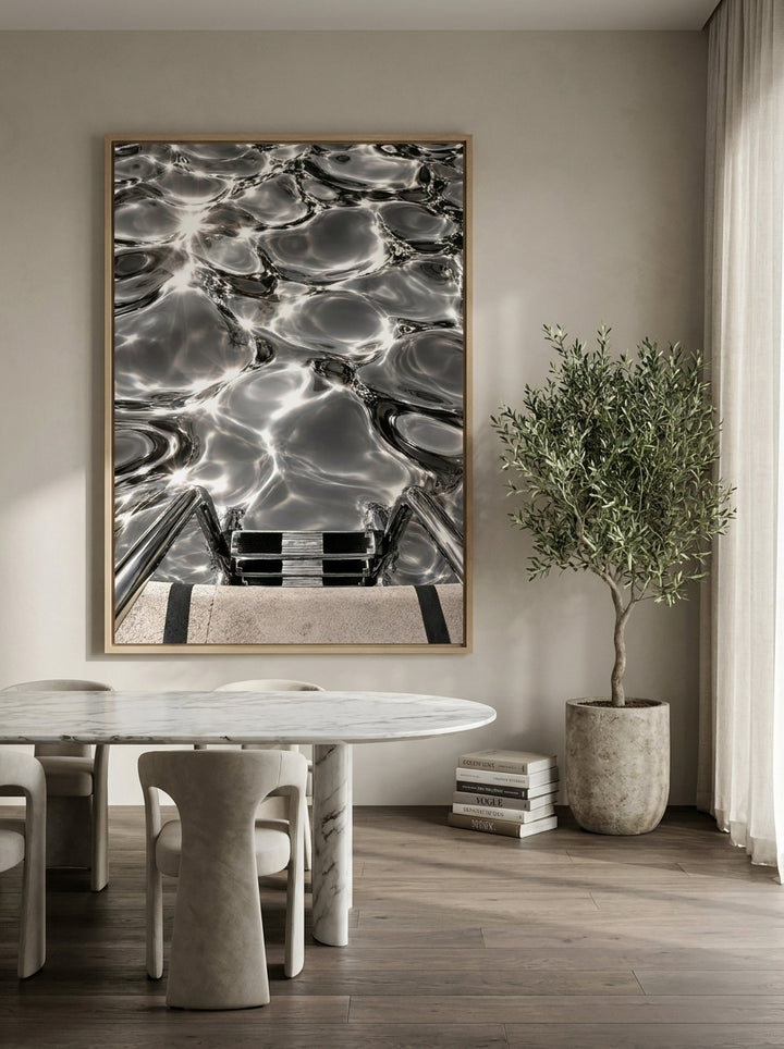 Oversized statement canvas wall art with a natural timber surround styled on the wall in a luxe dining room