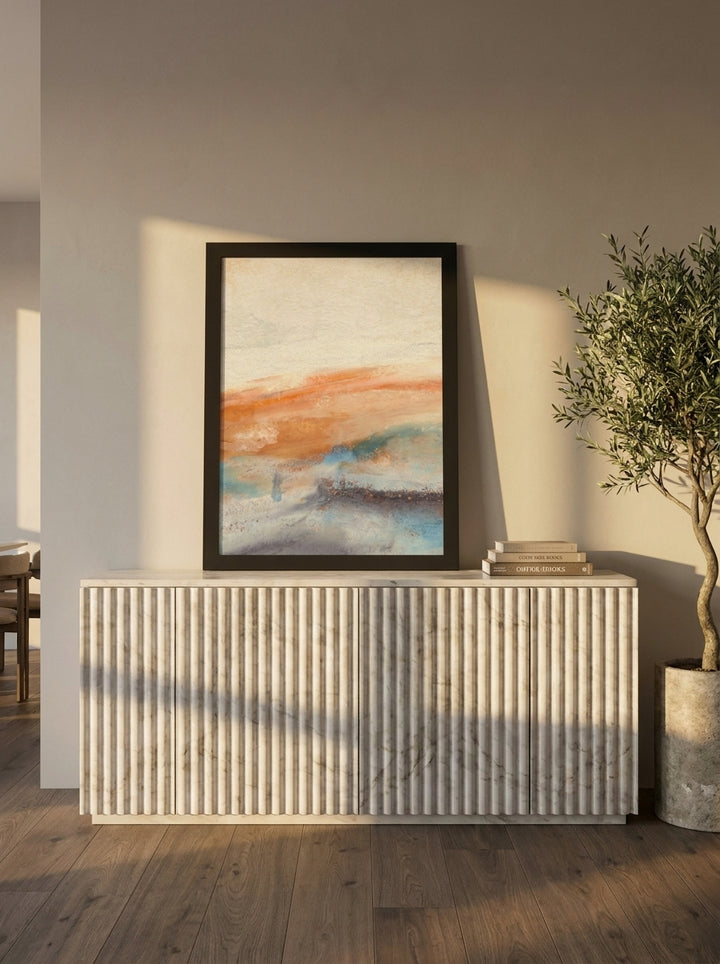 Modern wall art print standing on a sideboard in a luxe dining room