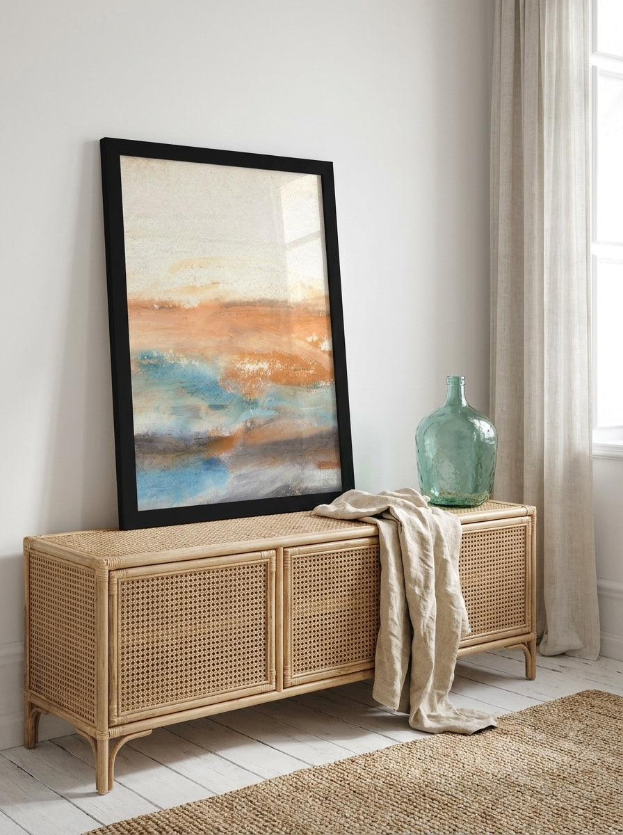 Modern wall art print standing on a sideboard in a coastal bedroom