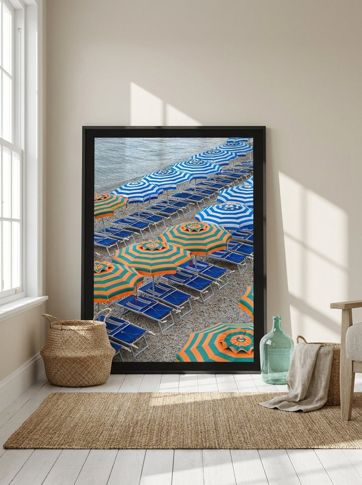 Oversized statement modern wall art print leaning against the wall in a coastal bedroom
