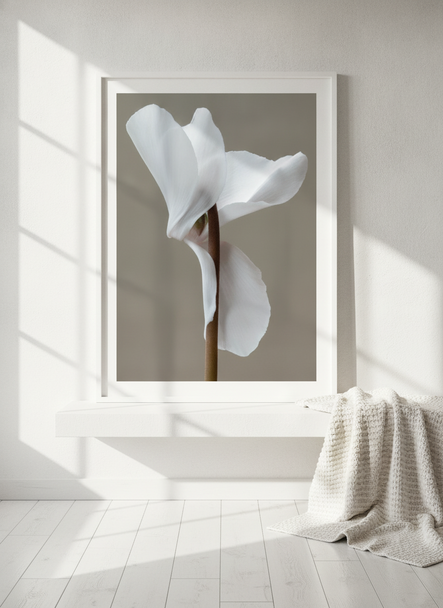 Modern wall art print standing on a shelf in a bright Scandinavian bathroom