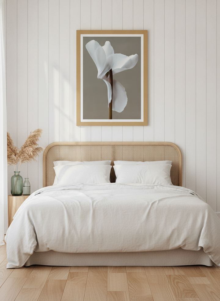 Modern wall art print styled on the wall in a coastal bedroom