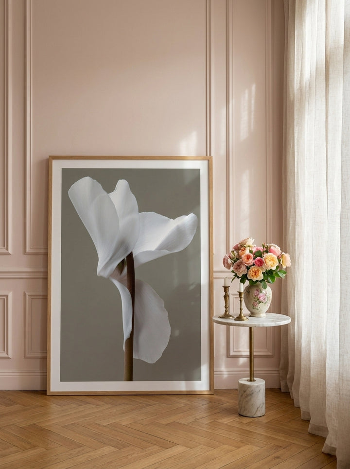 Oversized statement modern wall art print leaning against the wall in a Parisian dining room