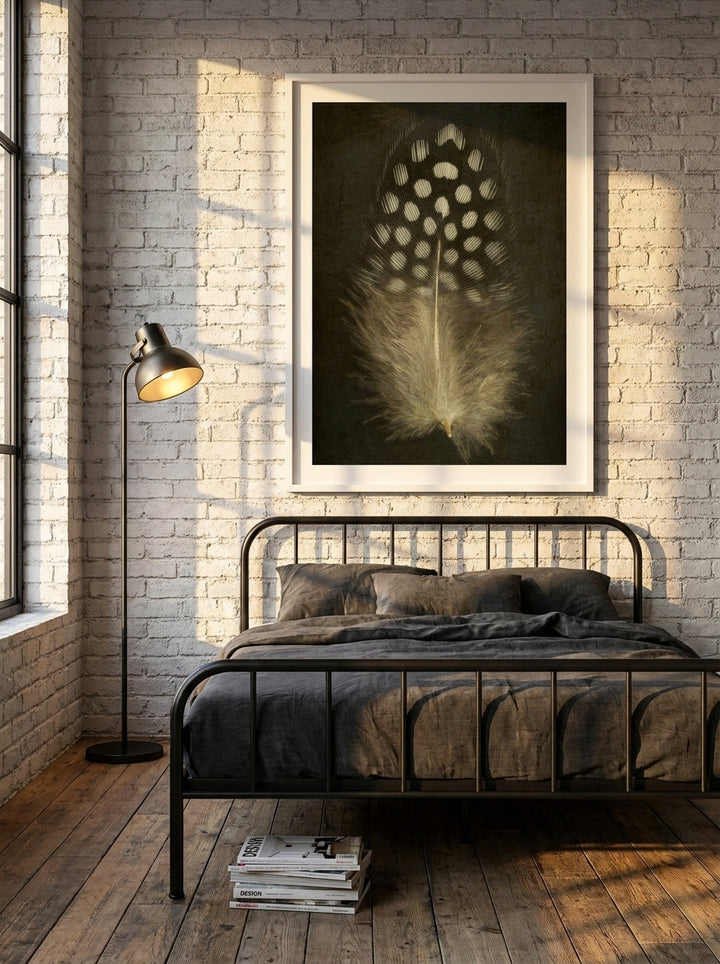 Modern wall art print styled on the wall in an industrial loft bedroom