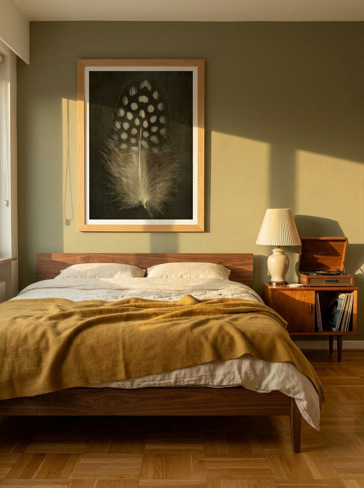 Modern wall art print styled on the wall in a mid-century bedroom