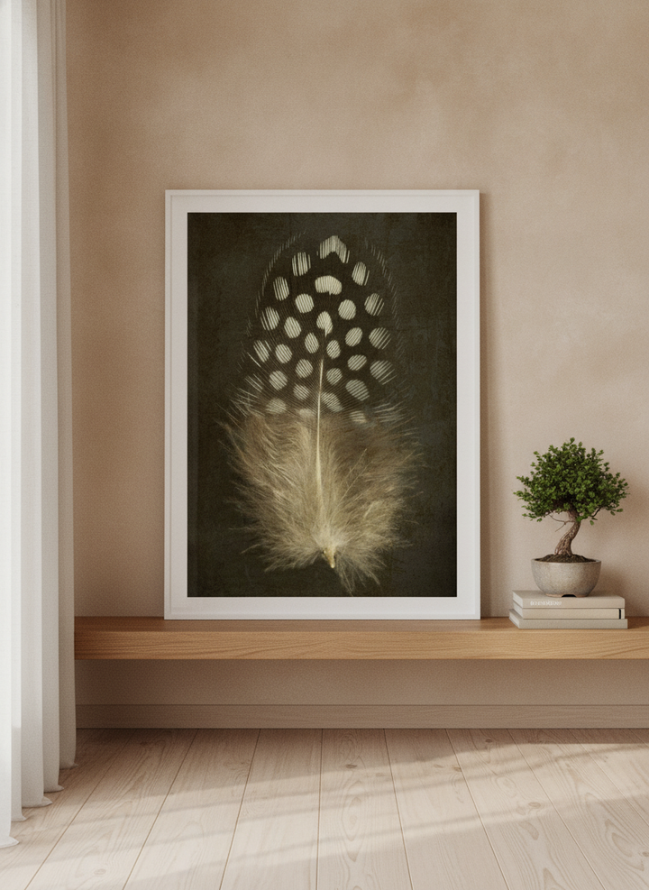 Modern wall art print standing on a shelf in a warm Japandi home office
