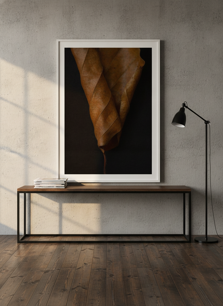 Modern wall art print standing on a console in an industrial loft home office