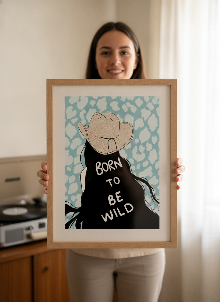 Person holding modern wall art print in a mid-century living room