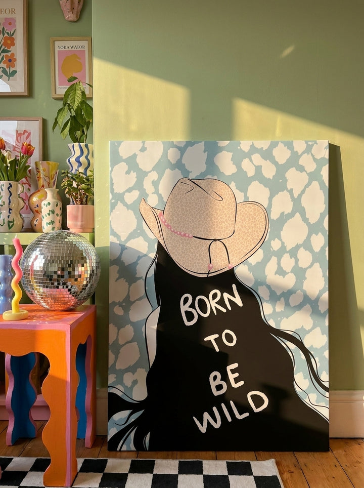 Stretched canvas wall art leaning against the wall in a colourful eclectic living room