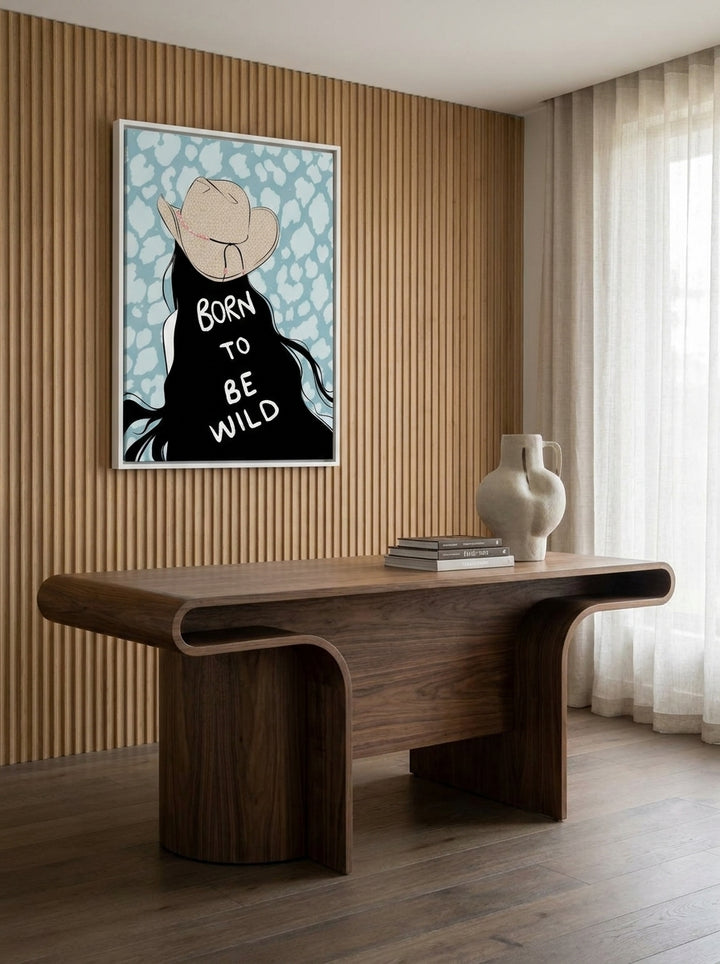 Canvas wall art with a white surround styled on the wall in a luxe home office