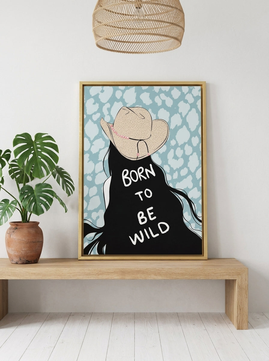 Canvas wall art with a gold leaf surround standing on a bench in a bright Scandinavian bedroom