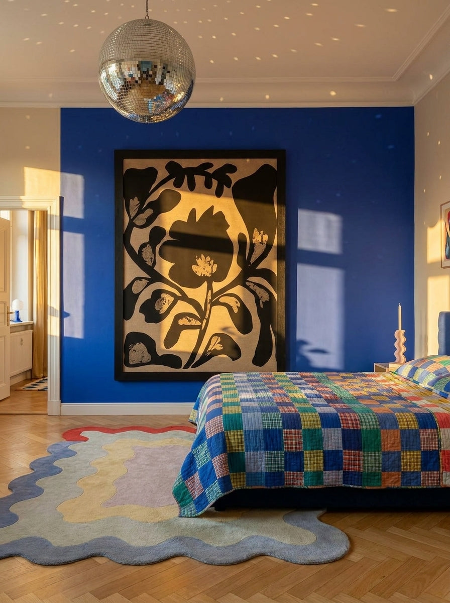 Oversized statement modern wall art print styled on the wall in a colourful eclectic bedroom