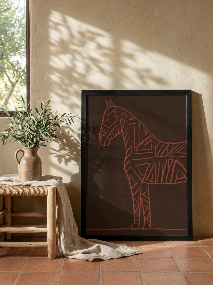 Modern wall art print leaning against the wall in a Mediterranean home office