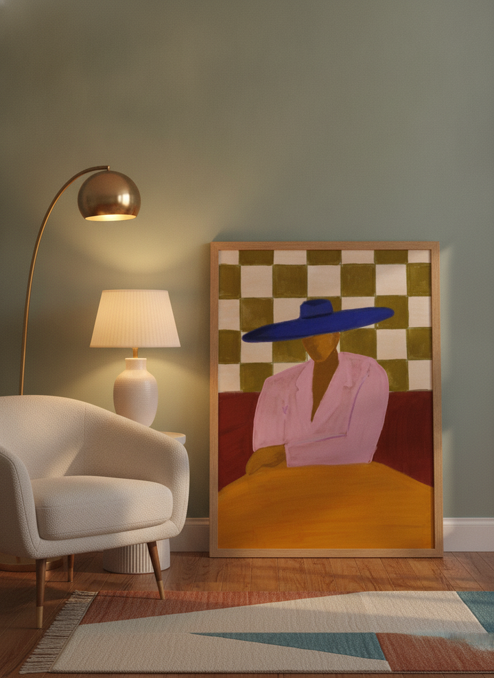 Modern wall art print leaning against the wall in a mid-century bedroom