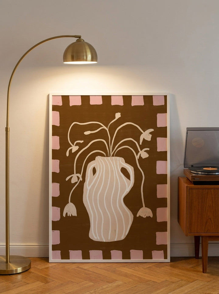 Modern wall art print leaning against the wall in a mid-century living room