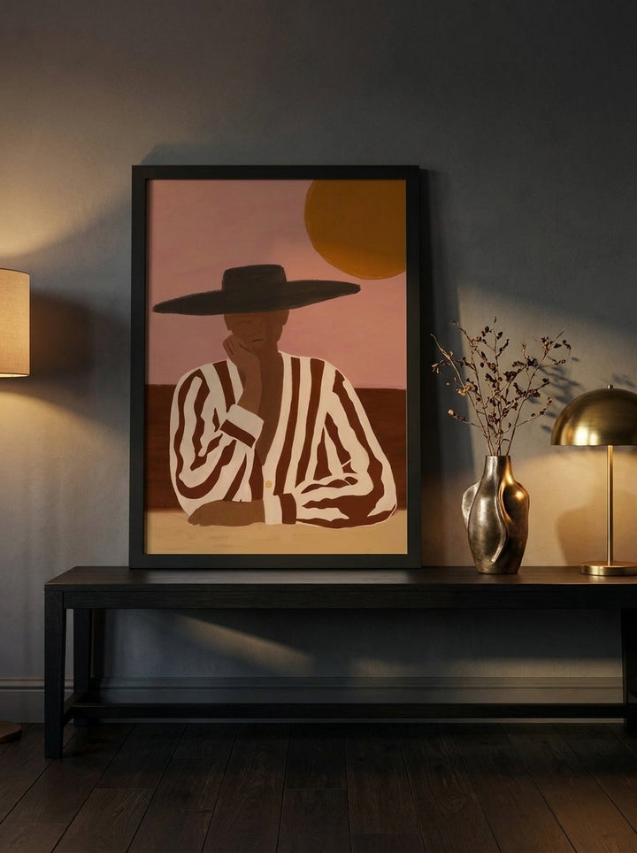 Modern wall art print standing on a console in a moody living room