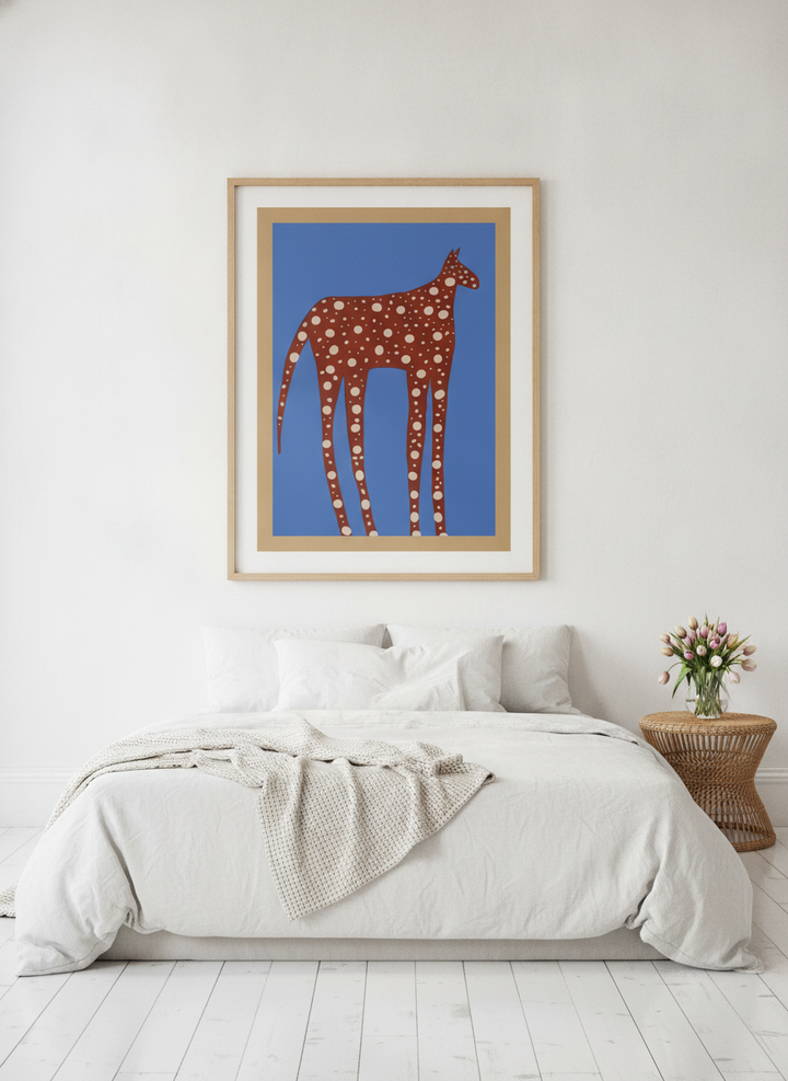 Oversized statement modern wall art print styled on the wall in a bright Scandinavian bedroom