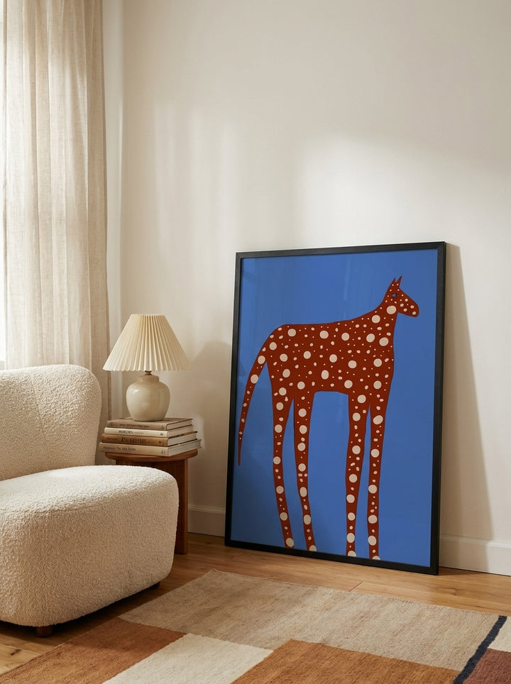 Modern wall art print leaning against the wall in a mid-century home office