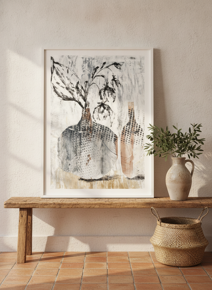 Modern wall art print standing on a bench in a Mediterranean bedroom