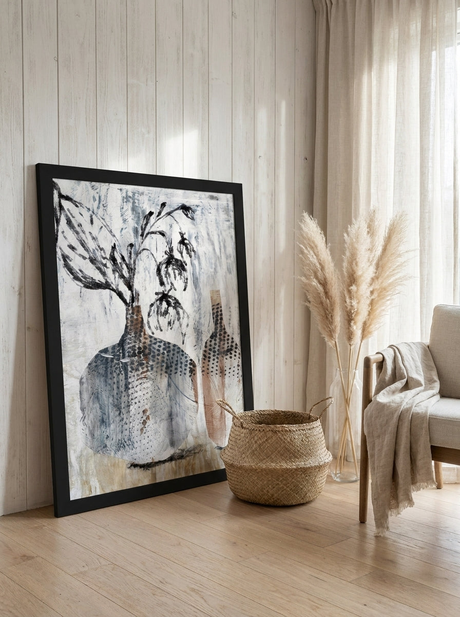 Oversized statement modern wall art print leaning against the wall in a coastal living room