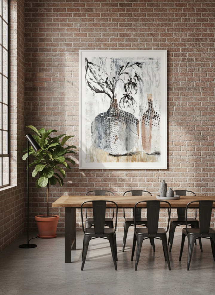Modern wall art print styled on the wall in an industrial loft dining room