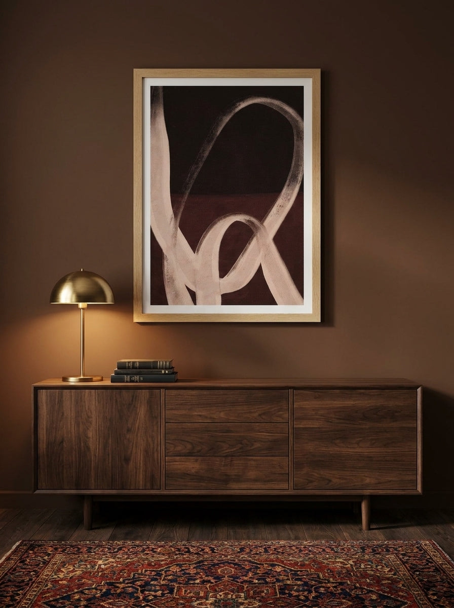 Modern wall art print styled on the wall in a moody living room