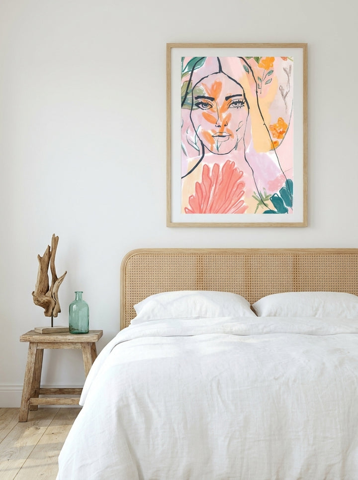 Modern wall art print styled on the wall in a coastal bedroom