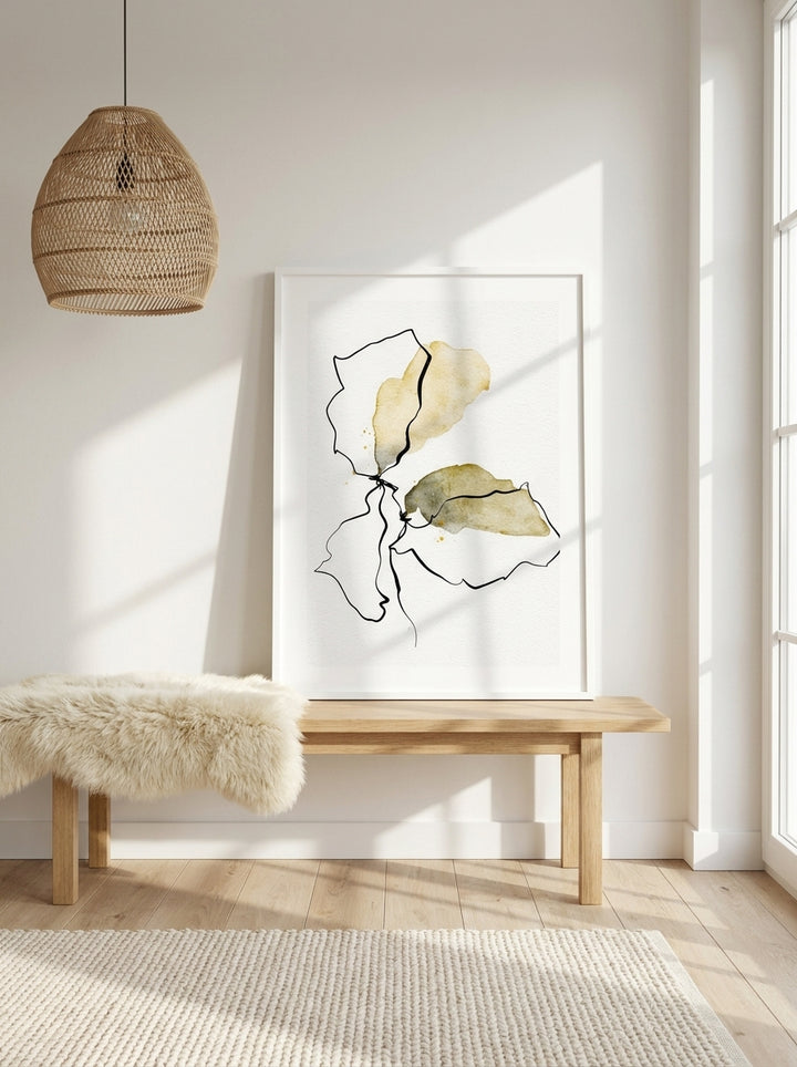 Modern wall art print standing on a bench in a bright Scandinavian home office