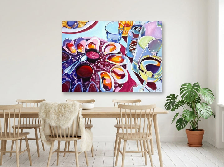 Stretched canvas wall art styled on the wall in a bright Scandinavian dining room