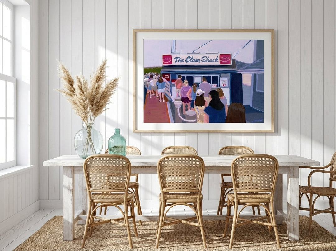 Modern wall art print styled on the wall in a coastal dining room