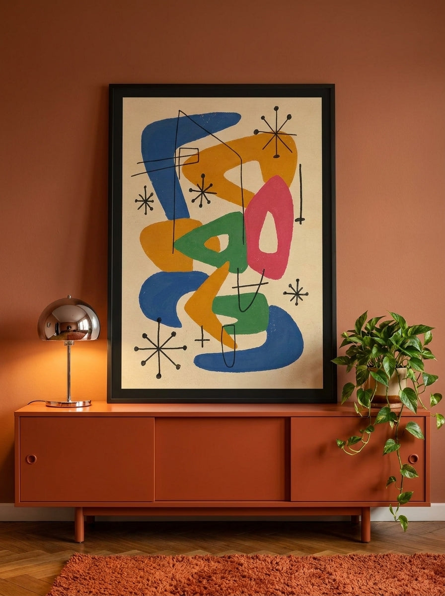 Modern wall art print standing on a sideboard in a retro 70s home office