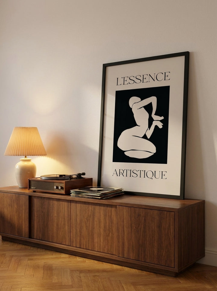 Modern wall art print standing on a sideboard in a mid-century living room
