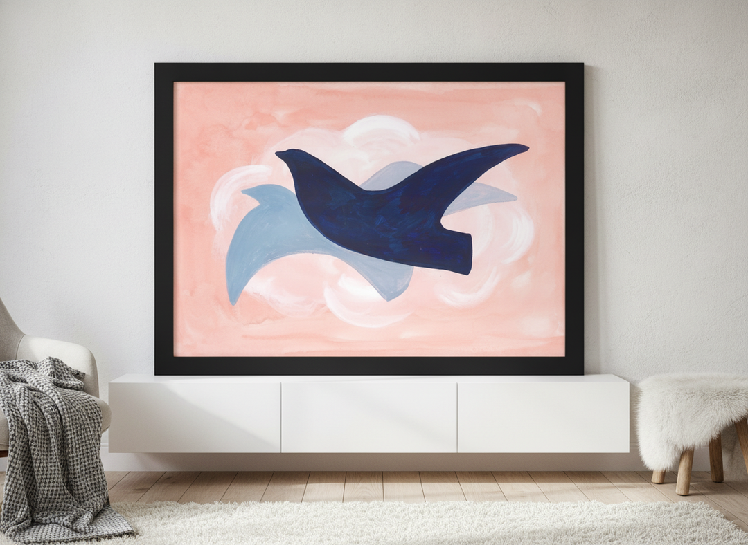 Modern wall art print standing on a sideboard in a bright Scandinavian bedroom