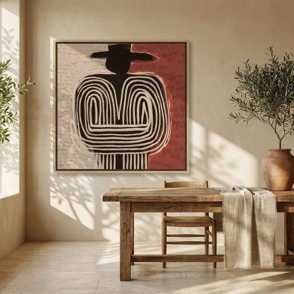 Canvas wall art with a natural timber surround styled on the wall in a Mediterranean home office