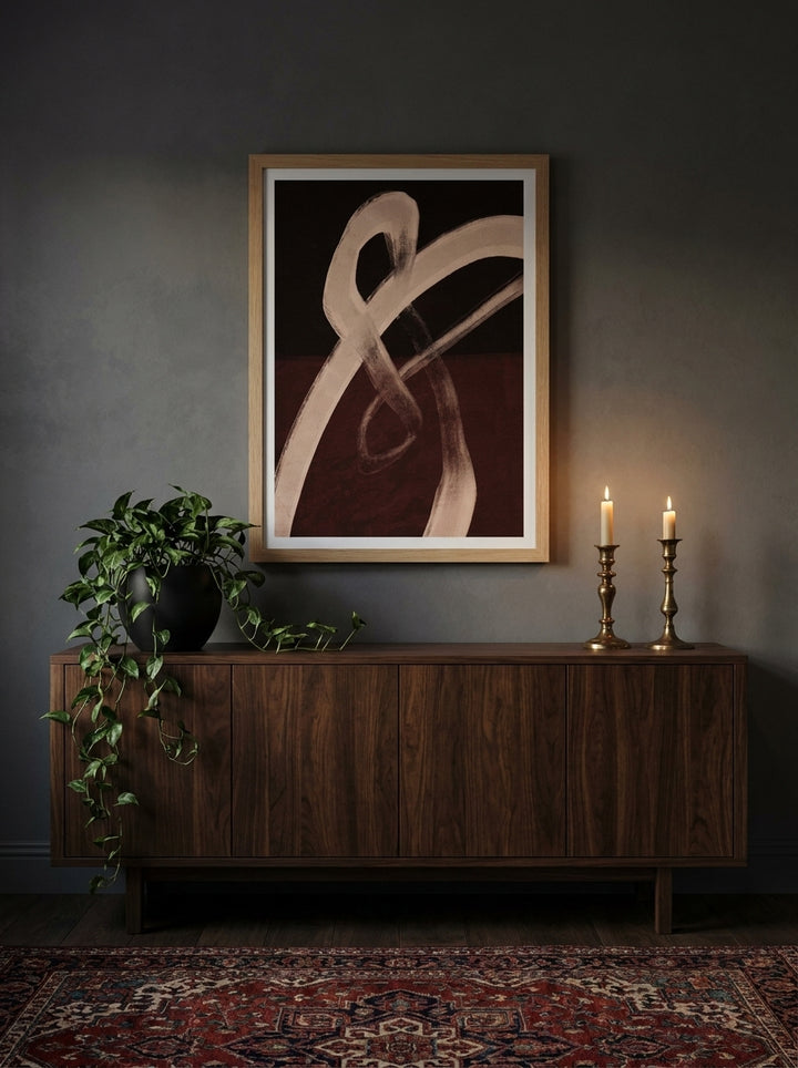 Modern wall art print styled on the wall in a moody living room