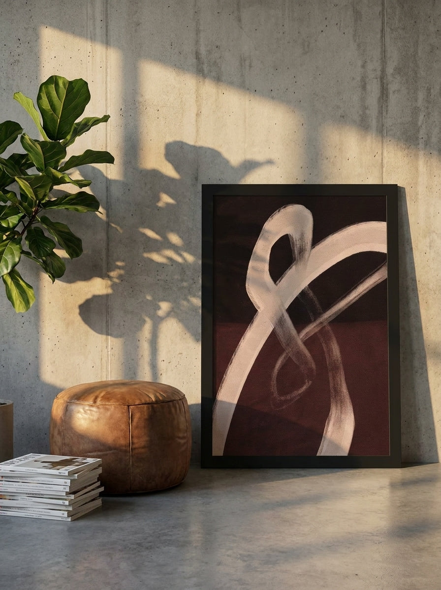 Modern wall art print leaning against the wall in an industrial loft living room