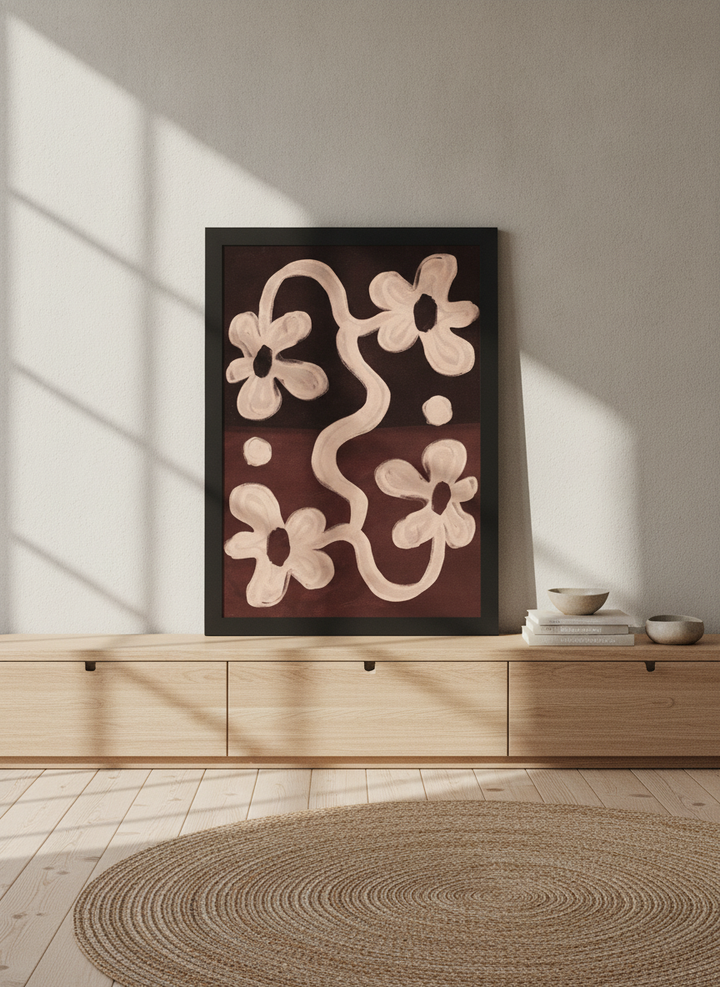 Modern wall art print standing on a sideboard in a warm Japandi bedroom
