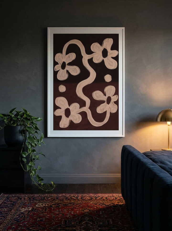 Modern wall art print styled on the wall in a moody bedroom